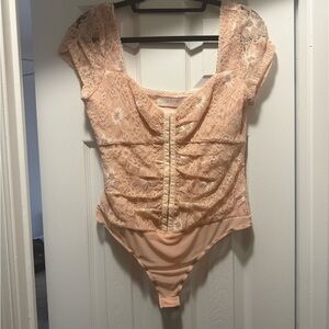 Astr lace body suit. Worn once size M